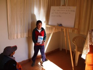 Milagros receiving Bible